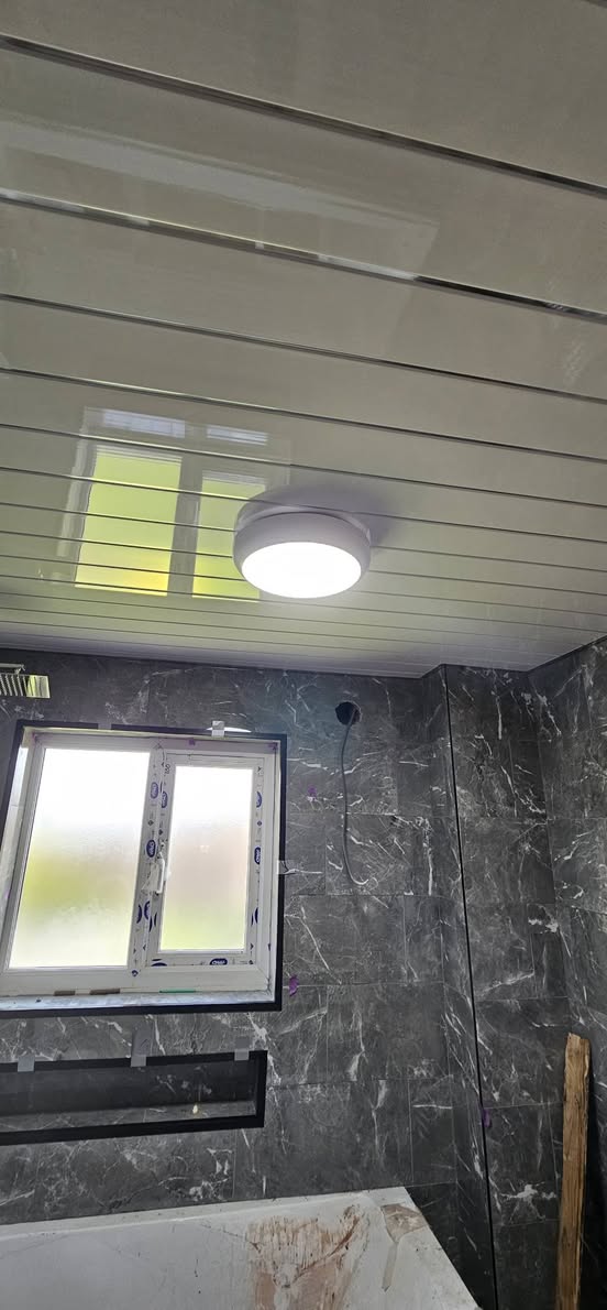 New Ansell Lighting bathroom light fitting installed and completed by electrician in Sheffield