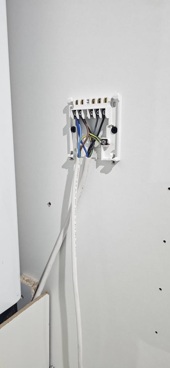 Faulty heating receiver being replaced by Sheffield electrician — before the repair